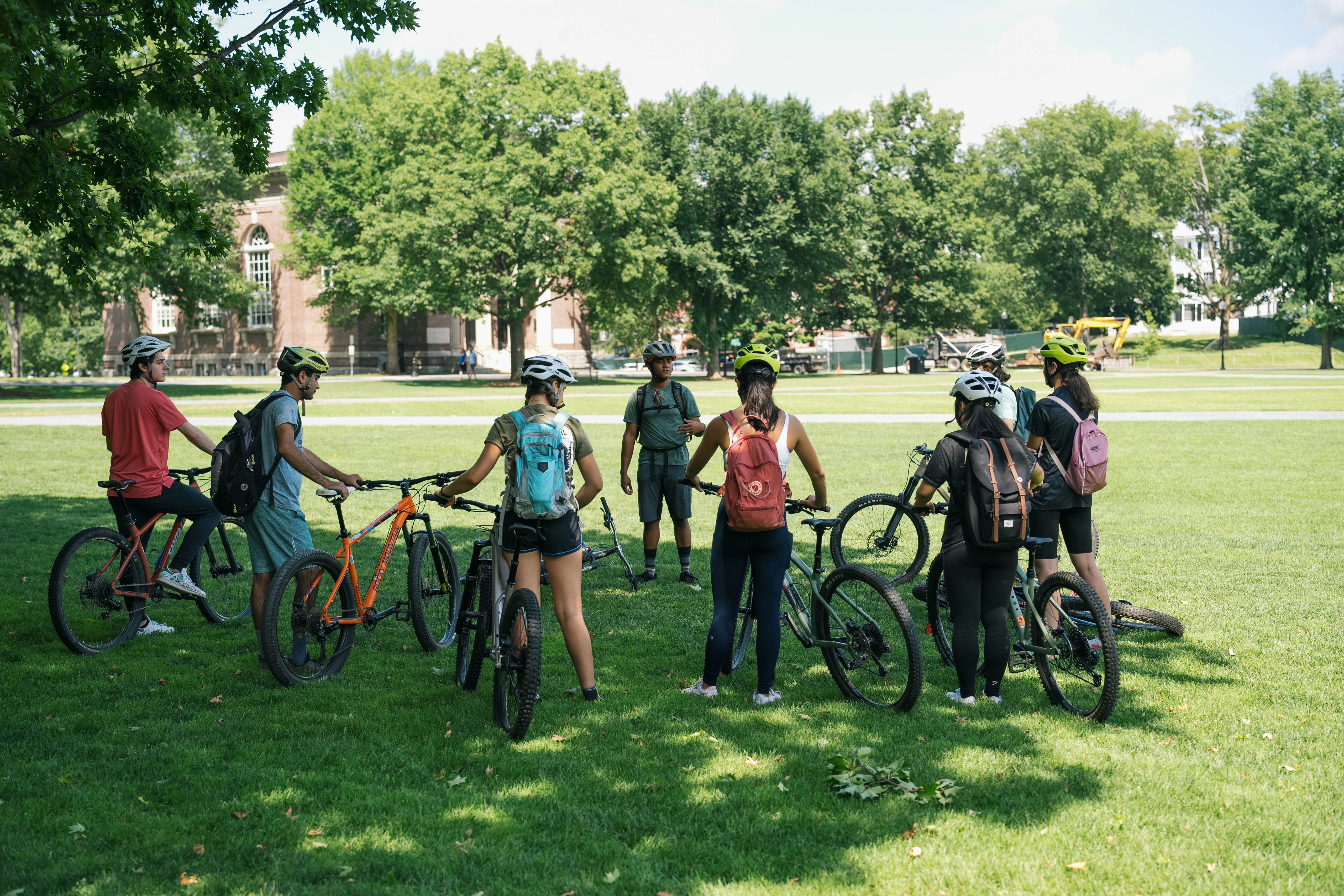 Students preparing for a mountain bike ride.